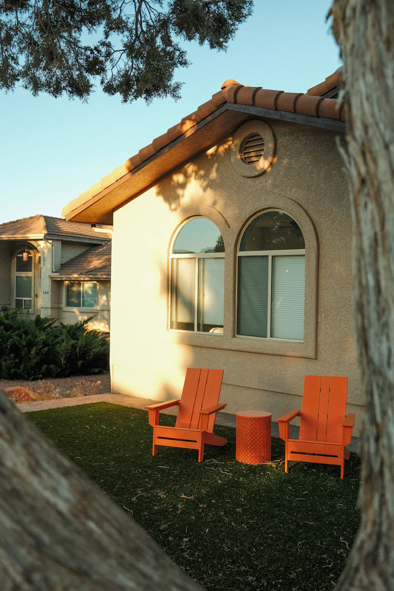 Arizona stucco home with tile roof and lush green lawn in the Southwest desert climate