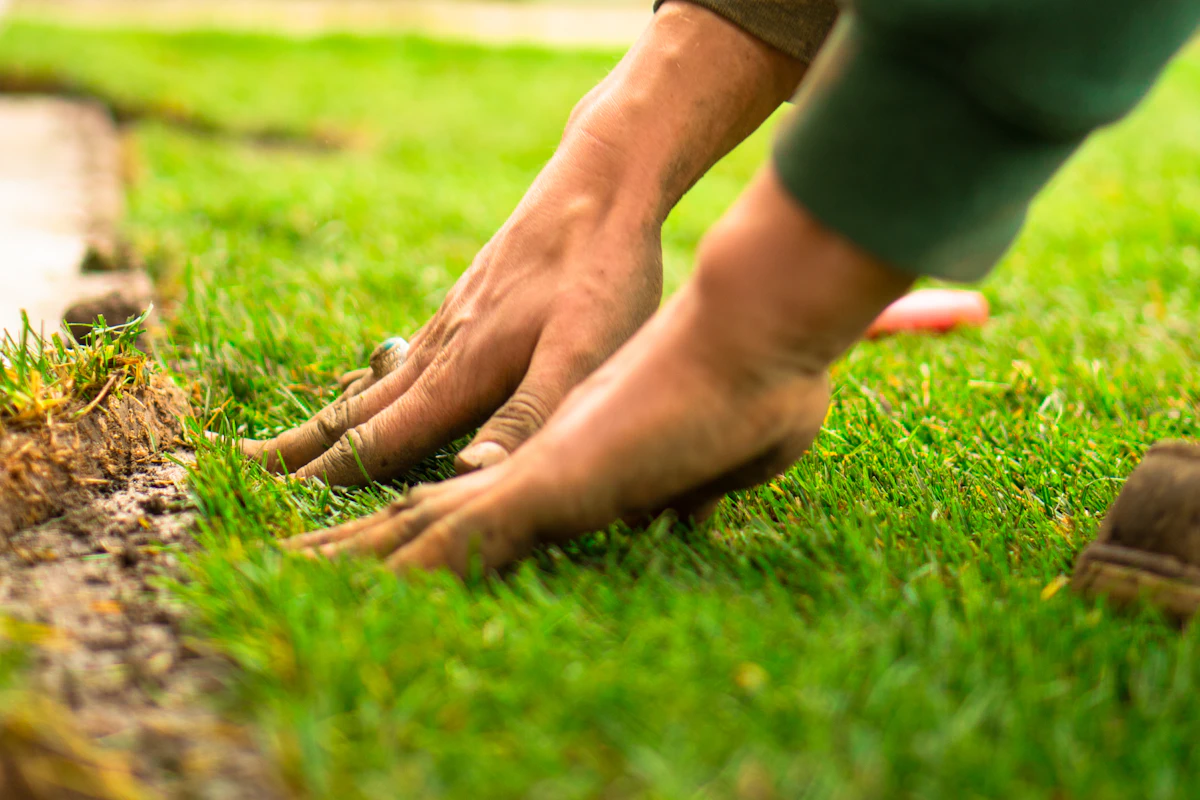 Artificial grass base installation showing crushed aggregate drainage layer for Tucson AZ